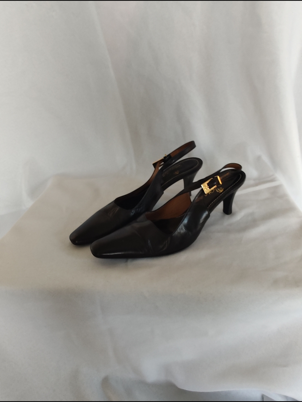 Elegant Black Leather Slingback Heels with Gold Buckle Accent
